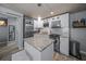Updated kitchen features stainless steel appliances, granite countertops, and a center island with bar seating at 2537 Ashton Rd, Sarasota, FL 34231