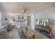 Living space featuring an updated kitchen, living room, and a sliding barn door at 2537 Ashton Rd, Sarasota, FL 34231