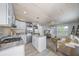 Open-concept living space features a renovated kitchen and cozy living room area at 2537 Ashton Rd, Sarasota, FL 34231