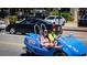 Tourists having fun in a novelty car with rentals and shops nearby at 2537 Ashton Rd, Sarasota, FL 34231