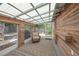 Enclosed sunroom with wood paneling, natural light, and comfortable seating at 2537 Ashton Rd, Sarasota, FL 34231
