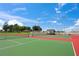 Beautiful tennis court with red and green surfaces, perfect for tennis enthusiasts at 2537 Ashton Rd, Sarasota, FL 34231