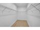 Walk-in closet with wood-look tile floors and wire shelving at 260 Marker Rd, Rotonda West, FL 33947
