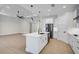 Open kitchen with stainless appliances, a center island, and a view of the living area at 260 Marker Rd, Rotonda West, FL 33947