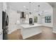 Modern kitchen with stainless steel appliances, quartz countertops, and island seating at 260 Marker Rd, Rotonda West, FL 33947