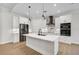 Bright, modern kitchen features stainless appliances, white cabinets, and quartz countertops at 260 Marker Rd, Rotonda West, FL 33947
