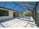 Screened-in pool and spa area with stone pavers and a covered patio, a perfect backyard oasis at 260 Marker Rd, Rotonda West, FL 33947