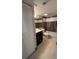 This bathroom features tile floors, a vanity, and a shower-tub combo at 2763 Woodgate Ln # 210, Sarasota, FL 34231