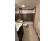 This bathroom features tile floors, a vanity, and a shower-tub combo at 2763 Woodgate Ln # 210, Sarasota, FL 34231
