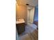 This bathroom features updated vanity and modern tile floors at 2763 Woodgate Ln # 210, Sarasota, FL 34231