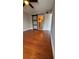 This bedroom features hardwood floors and a sliding barn door at 2763 Woodgate Ln # 210, Sarasota, FL 34231