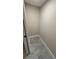 A walk-in closet with modern tile floors at 2763 Woodgate Ln # 210, Sarasota, FL 34231