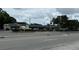 A commercial building with small stores in a suburban area at 2763 Woodgate Ln # 210, Sarasota, FL 34231