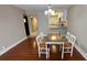 Bright dining room with direct access to kitchen and mirrored hall at 2763 Woodgate Ln # 210, Sarasota, FL 34231