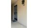 Condo entrance featuring new number art and modern light fixture at 2763 Woodgate Ln # 210, Sarasota, FL 34231
