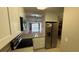 Modern kitchen with stainless steel appliances and granite countertops at 2763 Woodgate Ln # 210, Sarasota, FL 34231