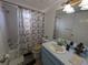 Bathroom with shower-tub combination, a vanity, and decorative fixtures at 2802 Jamaica St, Sarasota, FL 34231