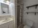Cozy bathroom with vanity, mirror, toilet, and stand up shower at 2802 Jamaica St, Sarasota, FL 34231