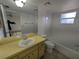 Bathroom featuring a tub-shower combo, window, and a vanity at 2802 Jamaica St, Sarasota, FL 34231
