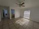 Bedroom featuring tile flooring, ample natural light, and a view to the attached bathroom at 2802 Jamaica St, Sarasota, FL 34231
