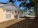 This exterior shows the well-maintained siding and multiple windows allowing natural light to fill the house at 2802 Jamaica St, Sarasota, FL 34231