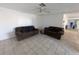 Inviting living room featuring neutral tile flooring, ceiling fan, and plenty of space for relaxation and entertainment at 2802 Jamaica St, Sarasota, FL 34231