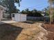 Backyard featuring storage shed with landscaping at 2802 Jamaica St, Sarasota, FL 34231