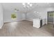Open-concept living room and kitchen with neutral colors and plenty of natural light at 343 Tenk St, Port Charlotte, FL 33953
