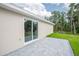 A covered patio with sliding glass doors at 343 Tenk St, Port Charlotte, FL 33953