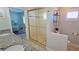 Bathroom featuring a glass-enclosed shower, toilet, and vanity at 3740 Gulf Of Mexico Dr # 116, Longboat Key, FL 34228