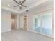 Spacious bedroom with a ceiling fan, recessed lighting, and access to a backyard patio at 380 Holly Rd, Venice, FL 34293