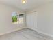 Bedroom featuring a closet, light neutral paint, stylish flooring and a bright window at 380 Holly Rd, Venice, FL 34293