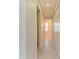 Hallway with tile flooring and white closet doors at 380 Holly Rd, Venice, FL 34293
