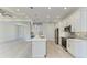 Well-appointed kitchen with center island, stainless appliances, and open floor plan at 380 Holly Rd, Venice, FL 34293