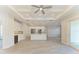 Spacious open-concept living area with kitchen island, stainless appliances, and tile flooring at 380 Holly Rd, Venice, FL 34293