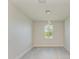 Bright room with modern chandelier and a window at 380 Holly Rd, Venice, FL 34293