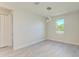 Sun-filled living space with modern lighting and bright window at 380 Holly Rd, Venice, FL 34293