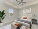 Serene bedroom with a king bed, stylish decor, and a ceiling fan for comfortable living at 380 Holly Rd, Venice, FL 34293