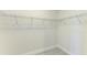 Walk-in closet featuring built-in shelving for optimal storage at 380 Holly Rd, Venice, FL 34293
