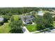 An aerial view of home featuring mature trees, private lake and lush landscaping at 3806 155Th E Ave, Parrish, FL 34219