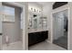 Well-lit bathroom with a dual vanity, neutral paint, and tile flooring at 3806 155Th E Ave, Parrish, FL 34219