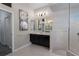 Bathroom featuring a dual vanity, neutral paint, and walk-in shower at 3806 155Th E Ave, Parrish, FL 34219