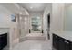 Elegant bathroom featuring a separate shower, soaking tub, and abundant natural light at 3806 155Th E Ave, Parrish, FL 34219