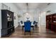 Dining area featuring wood floors and modern lighting at 3806 155Th E Ave, Parrish, FL 34219