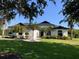 A charming one-story home with a well-manicured lawn and mature landscaping at 3806 155Th E Ave, Parrish, FL 34219