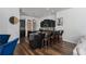 Modern kitchen with a large island, dark cabinetry, granite countertops, and barstool seating at 3806 155Th E Ave, Parrish, FL 34219