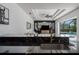 Open-concept kitchen features granite countertops, stainless steel sink, and view of the living area and pool at 3806 155Th E Ave, Parrish, FL 34219