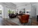 Living room area featuring wood floors and large windows at 3806 155Th E Ave, Parrish, FL 34219