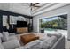 Spacious living room with sliding glass doors leading to the pool area and lush landscaping at 3806 155Th E Ave, Parrish, FL 34219