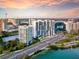 Stunning aerial view of the city skyline, buildings, and waterfront with lush trees at 4122 Central Sarasota Pkwy # 1923, Sarasota, FL 34238